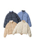 Four puffer jackets in different colors (black, blue plaid, beige, and cream floral) laid flat on a white background
