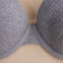 Close-up detail of light gray textured bra center showing stitching and fabric texture against a neutral beige background