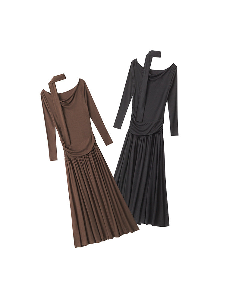 Product layout of two maxi dresses in brown and black colorways, featuring off-shoulder design, ruched bodice, and gathered skirt