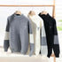 Collection view of mockneck sweaters in gray, white, and black