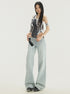 Angled front view, mid-body shot: Y2K jeans with light blue wash and wide-leg silhouette.