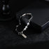Minimalist pearl and stainless steel bracelet on a black gift box, featuring geometric chain links and a modern charm.