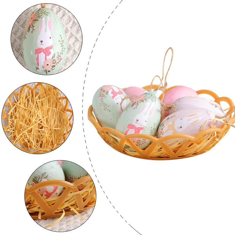 Easter egg set with pastel-colored hanging eggs featuring bunny designs, displayed in a decorative basket with shredded paper.
