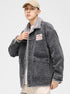 Model in acid wash denim jacket with gray sherpa collar, white tee and beige cap. Features OP Sailor's Shop chest patch