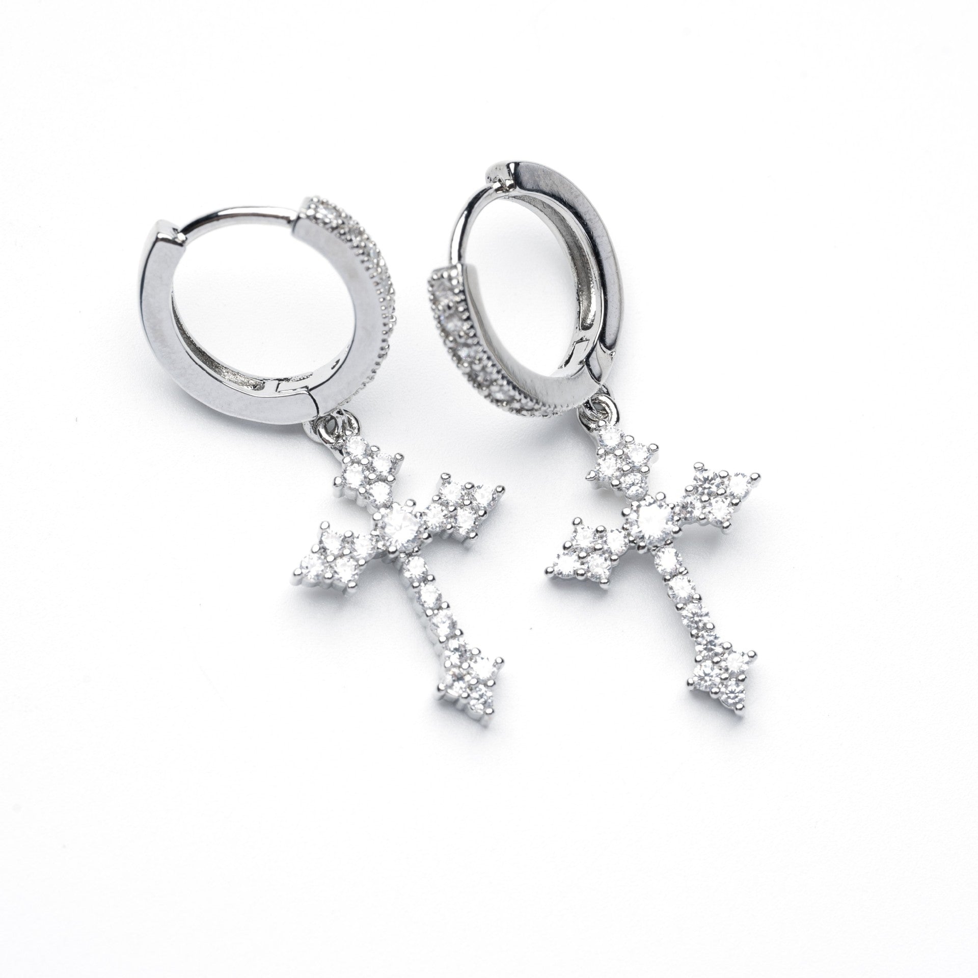Stainless steel zircon cross hoop earrings pair on white background, showing detailed stone settings