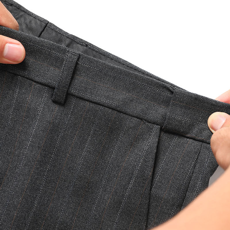 Trouser waistband detail showing belt loops and hook closure on premium pinstripe fabric