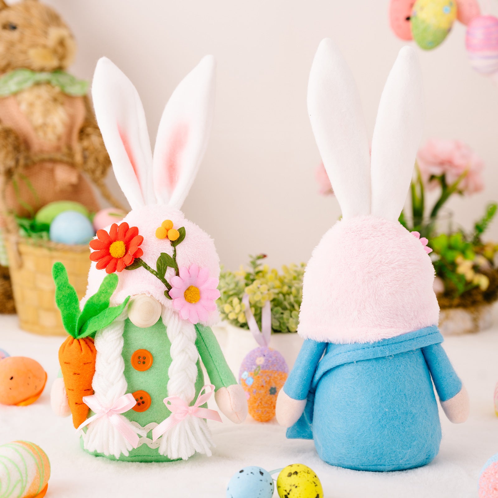 Back view of two Easter bunny gnomes, showing plush fabric and floral hat details, against a bright and cheerful spring setting.
