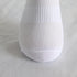 Close-up of white athletic sock showing detailed mesh ventilation pattern