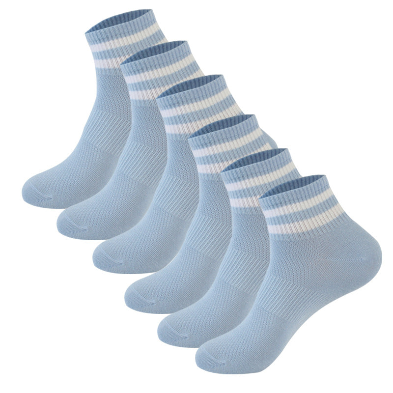 Six-pack of light blue ankle socks with white striped ribbed cuffs, displayed in a row against white background
