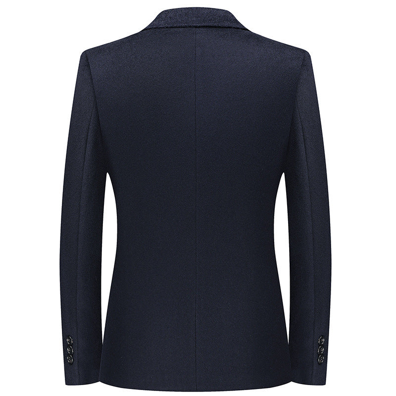 Back view of navy blue blazer showing sleek silhouette with three-button sleeve detail at cuffs