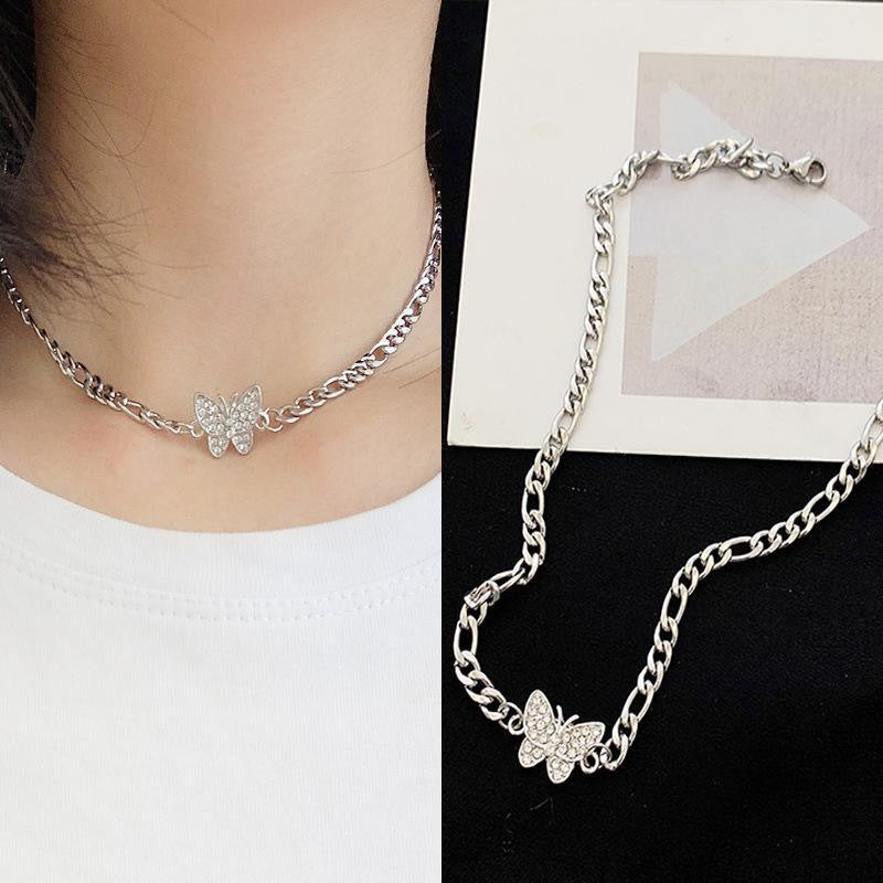 Split image: Silver butterfly necklace worn with white top, and product shot on black background