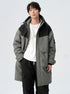 A man showing the back view of gray/black colorblock technical parka with hood detail against white background