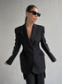 Structured Boss Babe blazer with strong shoulder silhouette and slim waist, styled with black sunglasses for executive look