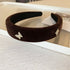 Brown velvet padded headband decorated with rhinestone butterfly appliques