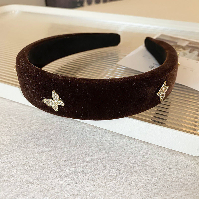 Brown velvet padded headband decorated with rhinestone butterfly appliques