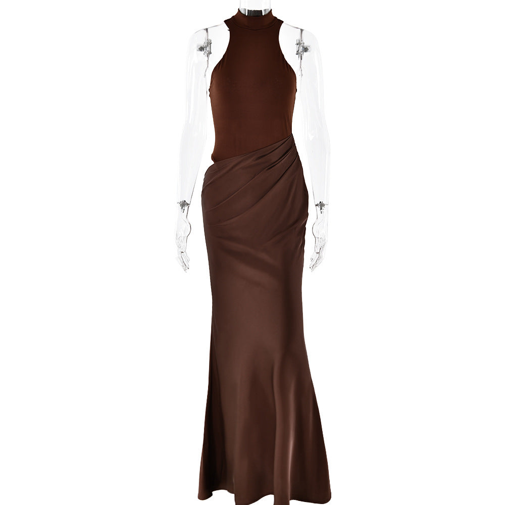 Brown floor-length halter dress with form-fitting bodice and draped skirt, displayed on a mannequin with transparent arms
