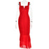 A red ruched bodycon dress with cutout detail and sheer tiered hem displayed on transparent mannequin against white background