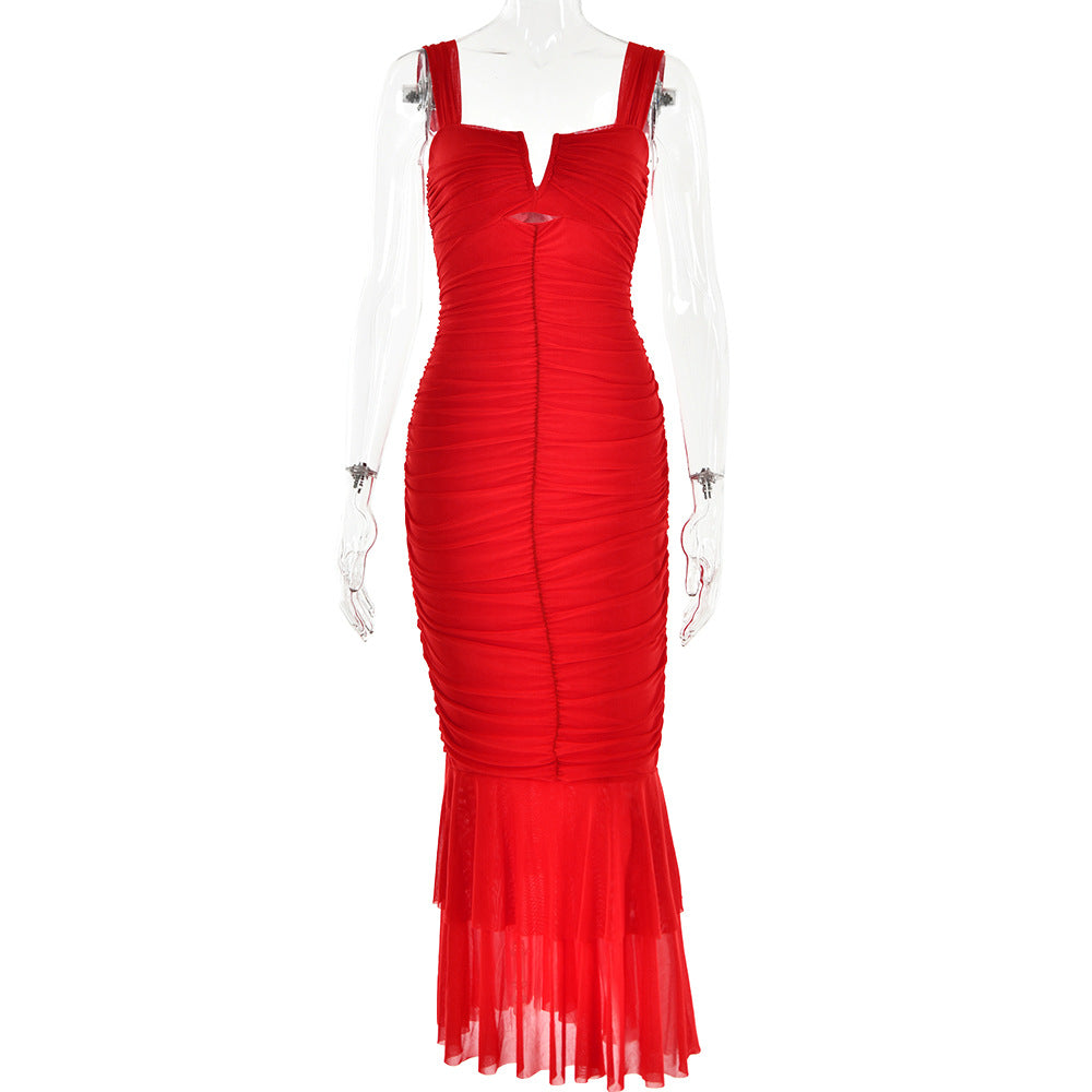 A red ruched bodycon dress with cutout detail and sheer tiered hem displayed on transparent mannequin against white background