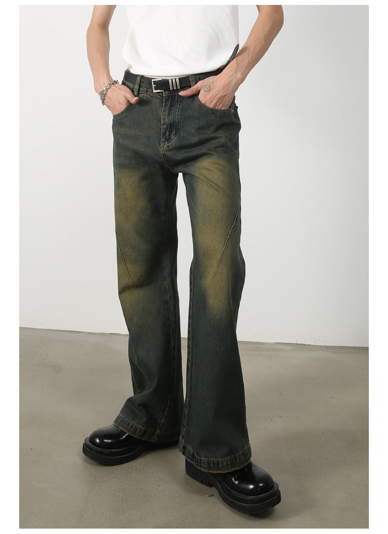 Flat lay product shot of olive-green wide-leg denim pants with classic five-pocket styling, button closure and subtle faded washing