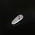 White decorative clip with star and crystal details against black background