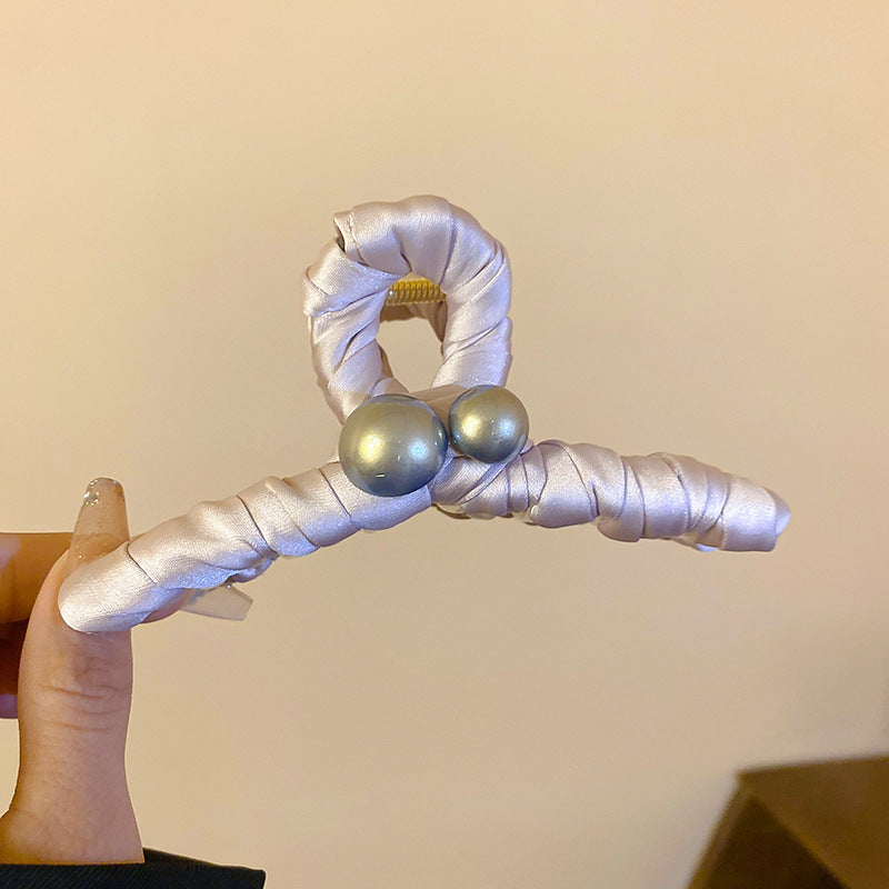 White satin-wrapped hair clip with pearl embellishments