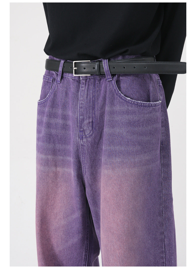 A model is wearing purple wide-leg jeans with a black top and leather belt, showing waist-to-thigh view against white background