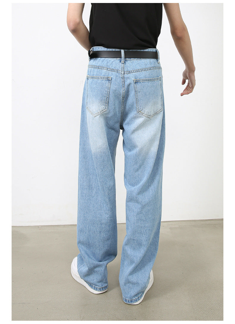 A model is wearing light blue wide-leg jeans with a black top and belt, showing the back view against white background