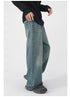 Model wearing purple wide-leg jeans with black belt, black top and two-tone loafers against white background