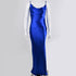 Royal blue silk gown on mannequin, showing fitted silhouette and cowl neckline against light gray backdrop
