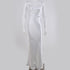 White silk evening gown displayed on mannequin, full-length view showing simple elegant cut against gray backdrop