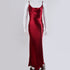 Deep red silk maxi dress on mannequin, showing fitted silhouette and spaghetti straps against white background