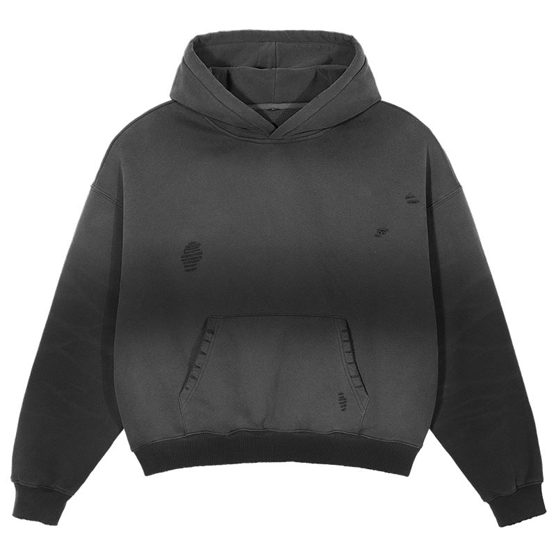 Front view of black distressed hoodie with gradient effect, kangaroo pocket and subtle worn detailing on white background