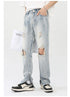 Side profile of distressed light wash denim with knee tears and ankle zips, paired with white t-shirt on white background