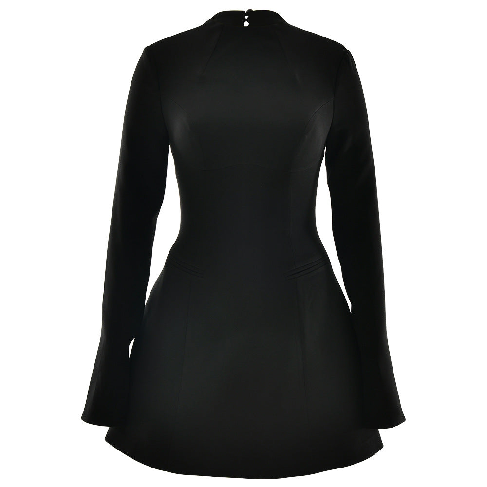 A black structured mini dress with high neckline, long sleeves, and A-line silhouette, shown without a model on neutral background