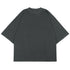 Flat lay product shot of charcoal gray oversized mock neck t-shirt with wide sleeves against white background