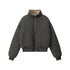 A quilted dark gray bomber jacket with leopard print collar accent photographed flat against white background, featuring ribbed cuffs and zippered front closure
