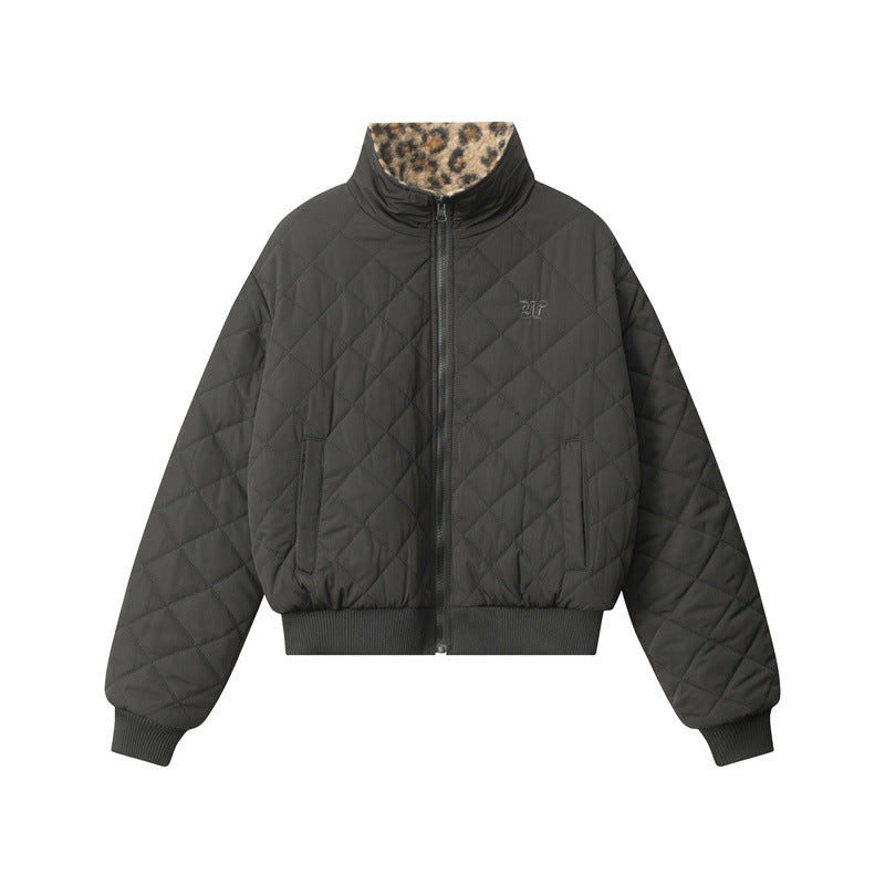 A quilted dark gray bomber jacket with leopard print collar accent photographed flat against white background, featuring ribbed cuffs and zippered front closure