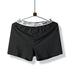 Black boxer short with white waistband reading 'HELLO' and 'UNDERWEAR MAN', displayed on hanger against white background