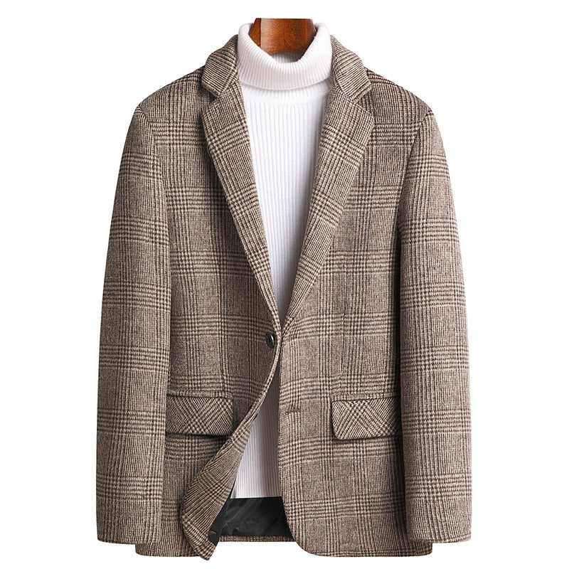 A mannequin wearing a beige glen plaid blazer with white turtleneck. Single-button closure, notched lapels and flap pockets create a refined smart-casual look