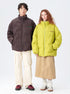 Models wearing Impressionism puffer jackets in yellow and brown, styled with casual wear