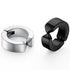 Pair of silver and black stainless steel huggie hoop earrings with minimalist design against white background