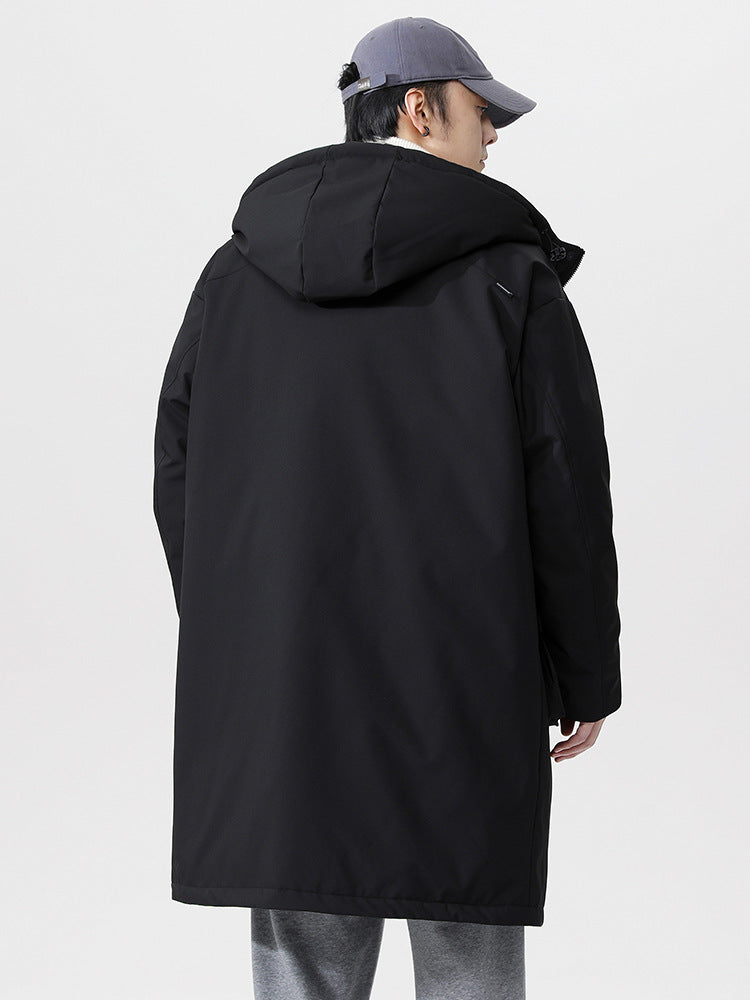 A man wearing gray cap shows back view of black NEIGHBORHOOD parka with hood detail against white background displaying coat construction