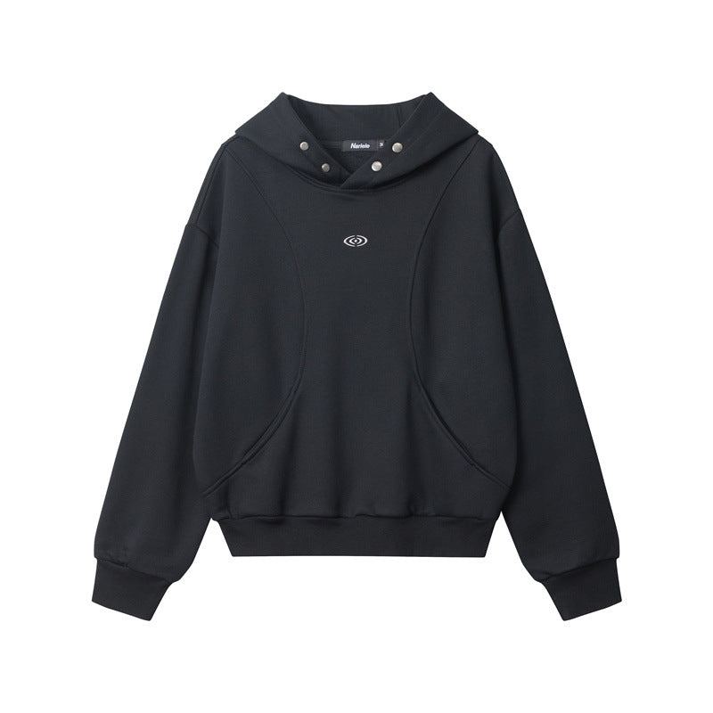 Black hooded sweatshirt with curved seam design, snap-button hood detail, embroidered eye logo on chest, and ribbed cuffs