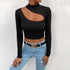 Detailed view of black long-sleeve crop top with asymmetrical cutout and mock neck