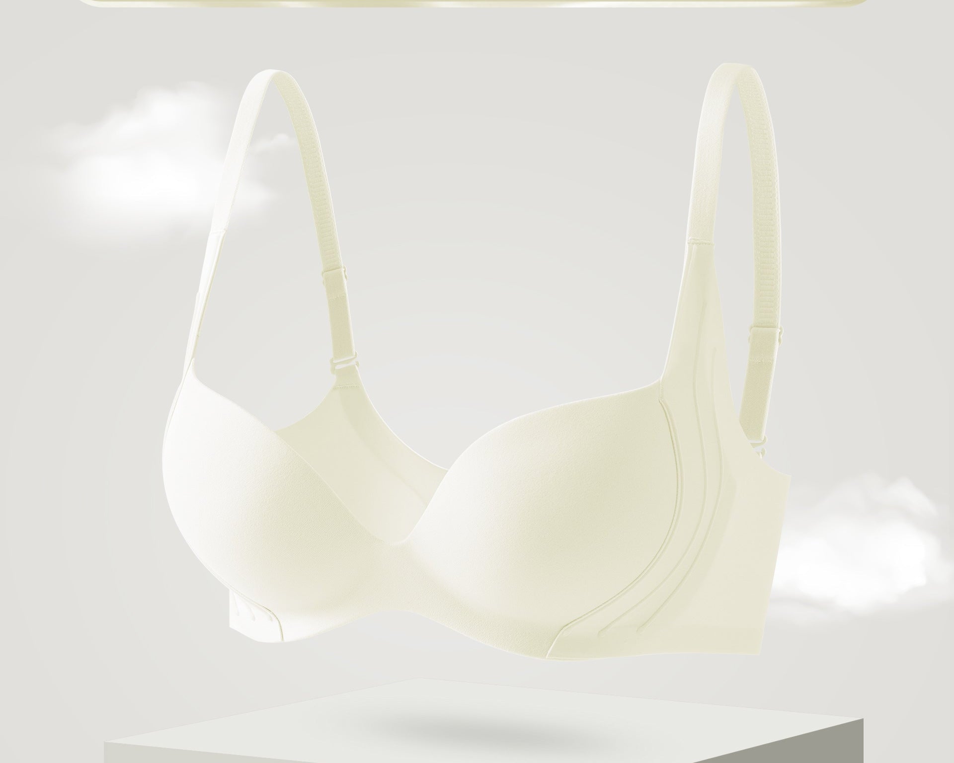 Floating display of a seamless white push-up bra with soft support and molded cups for natural lift.