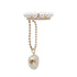 Product shot of pearl and crystal ear cuff with gold ball chain and pearl charm