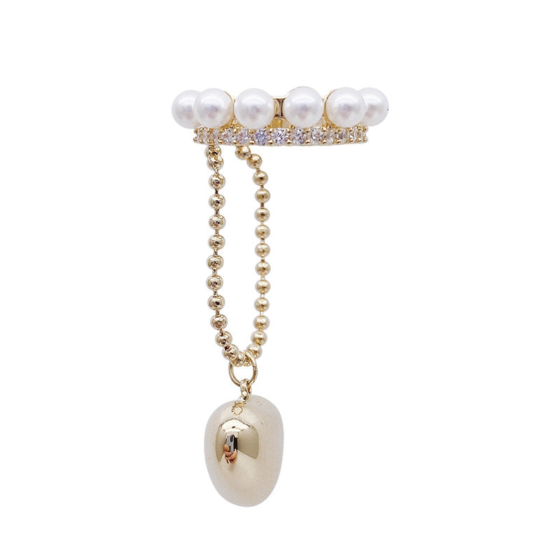 Product shot of pearl and crystal ear cuff with gold ball chain and pearl charm