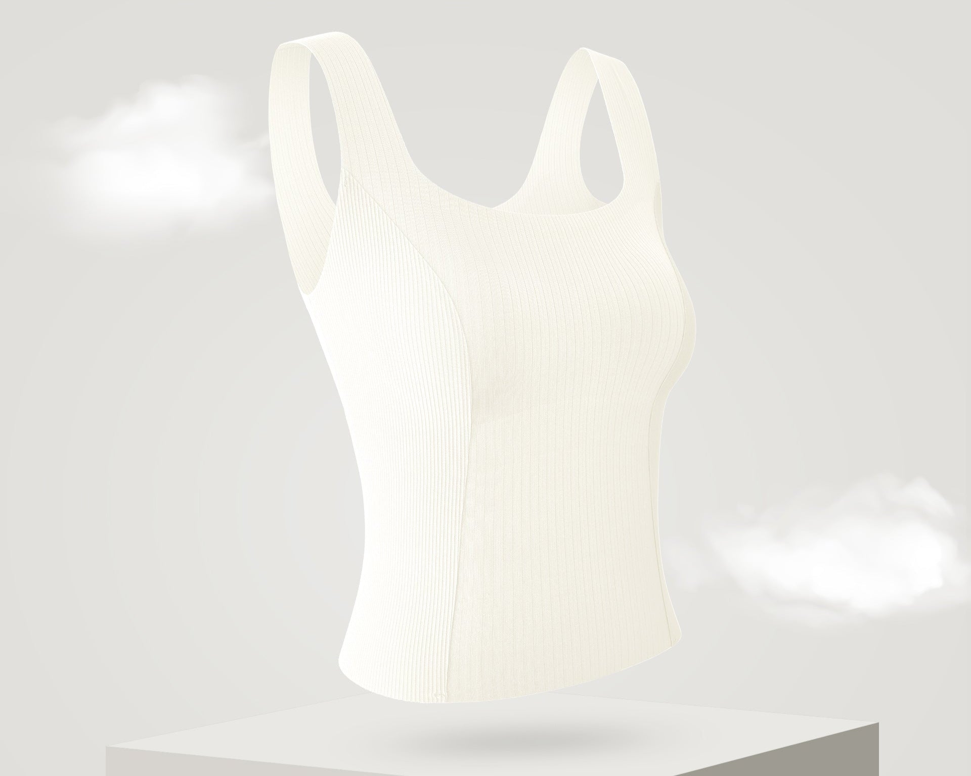 White ribbed tank top with built-in bra, featuring a seamless and breathable design.