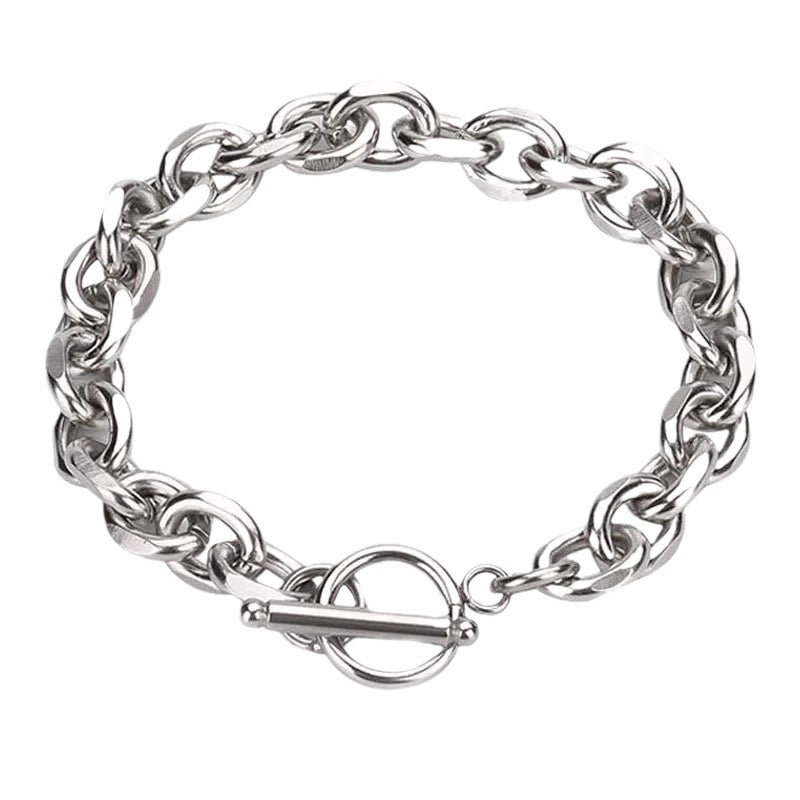 Standalone image of a silver chain bracelet with a toggle clasp on a white background.