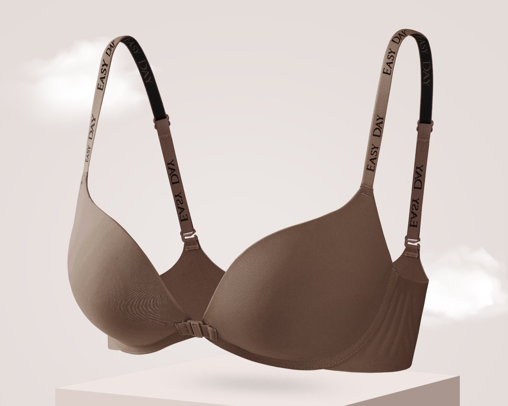 Seamless wireless bra in brown with front clasp and logo straps for lift and comfort.